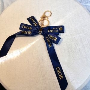 NWOT - ribbon keychain blue and gold "dior" printed with clip